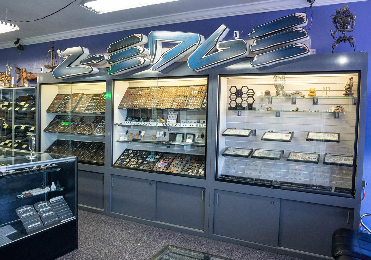 Lit jewelry cases under the Z-Edge sign