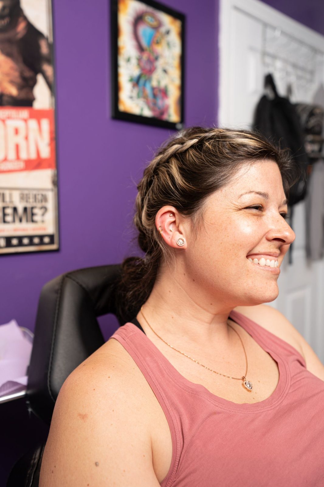 A smiling client after her new piercing