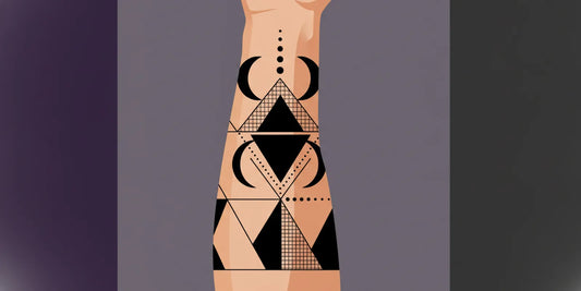 Blackwork tattoo design with bold black shapes and fine line details on an arm