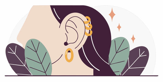Curated ear stack featuring a gold curved barbell in a rook piercing