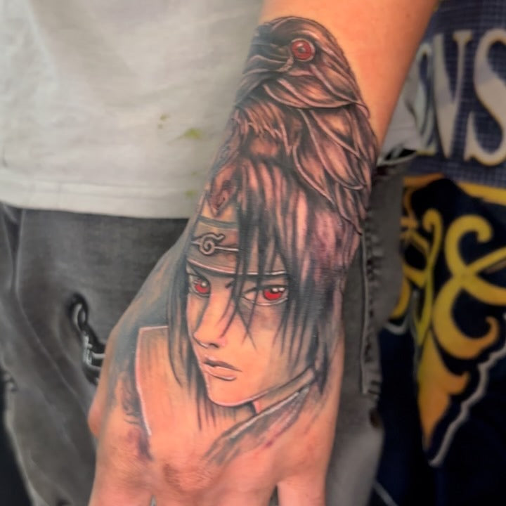 Tattoo by Manny at Z-Edge Gulf Gate: itachi anime color hand