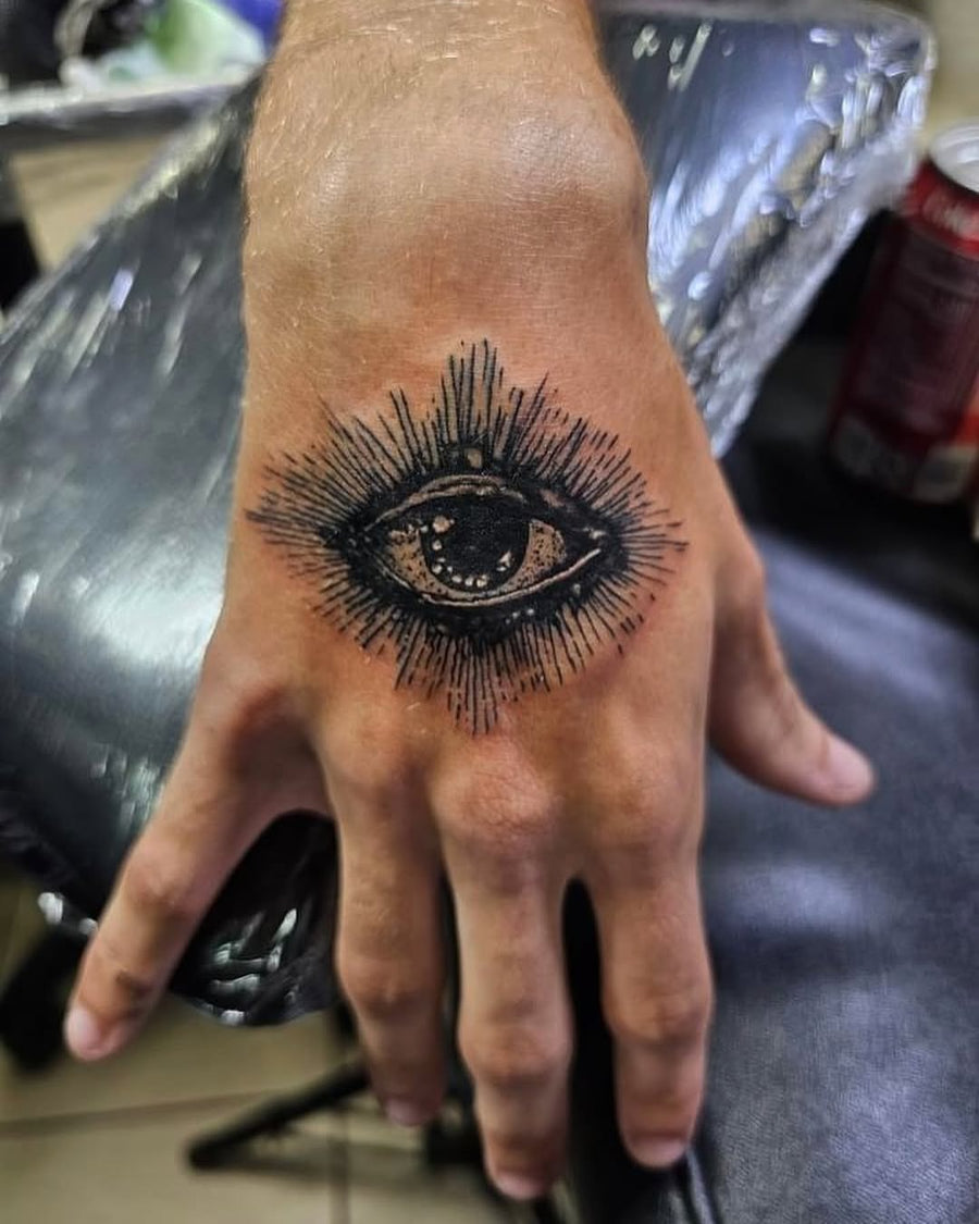 Tattoo by Manny at Z-Edge Gulf Gate: realistic eye black grey hand