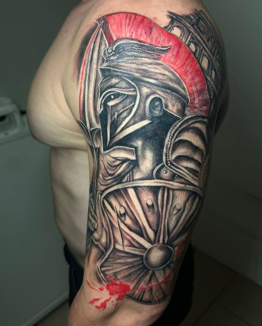 Tattoo by Manny at Z-Edge Gulf Gate: spartan helmet black grey red shoulder