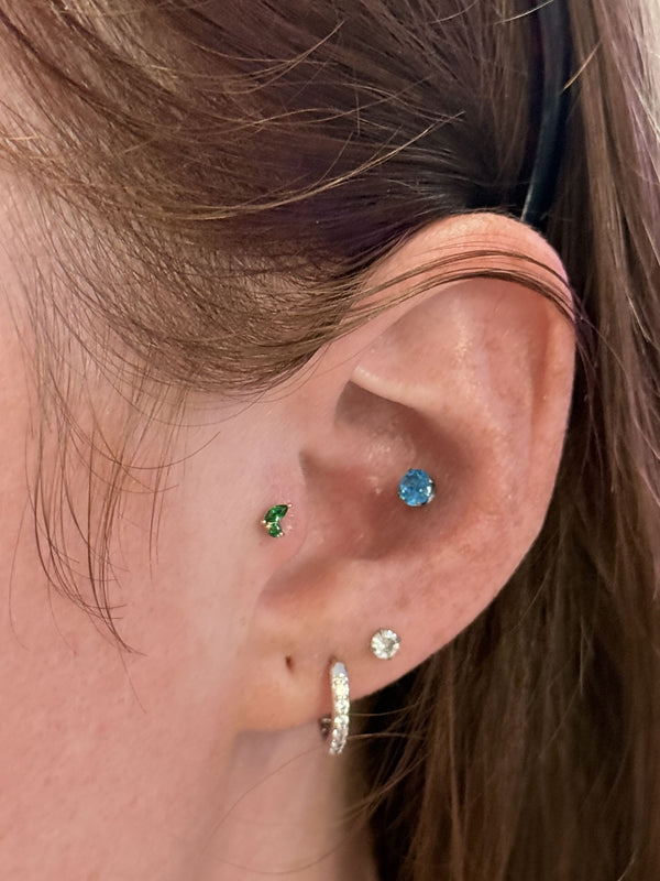 Conch and tragus with color gems