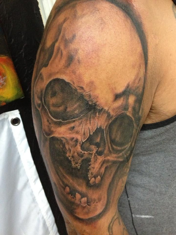 Black and grey skull tattoo