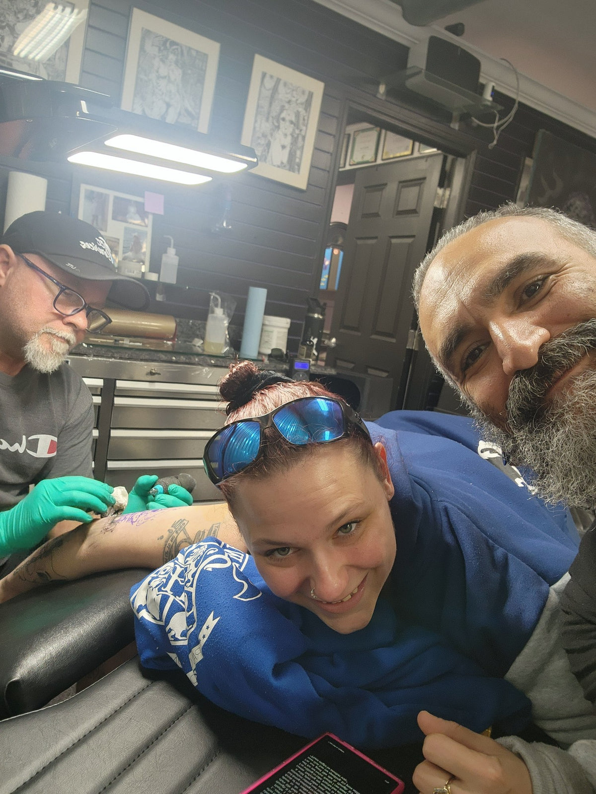 A Z-Edge artist and client taking a selfie in the studio